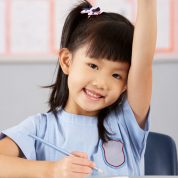 girl with hand raised girl with hand raised